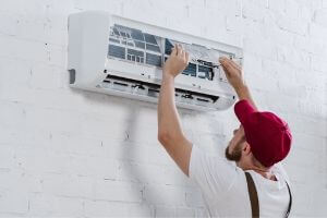 technician replacing air filter
